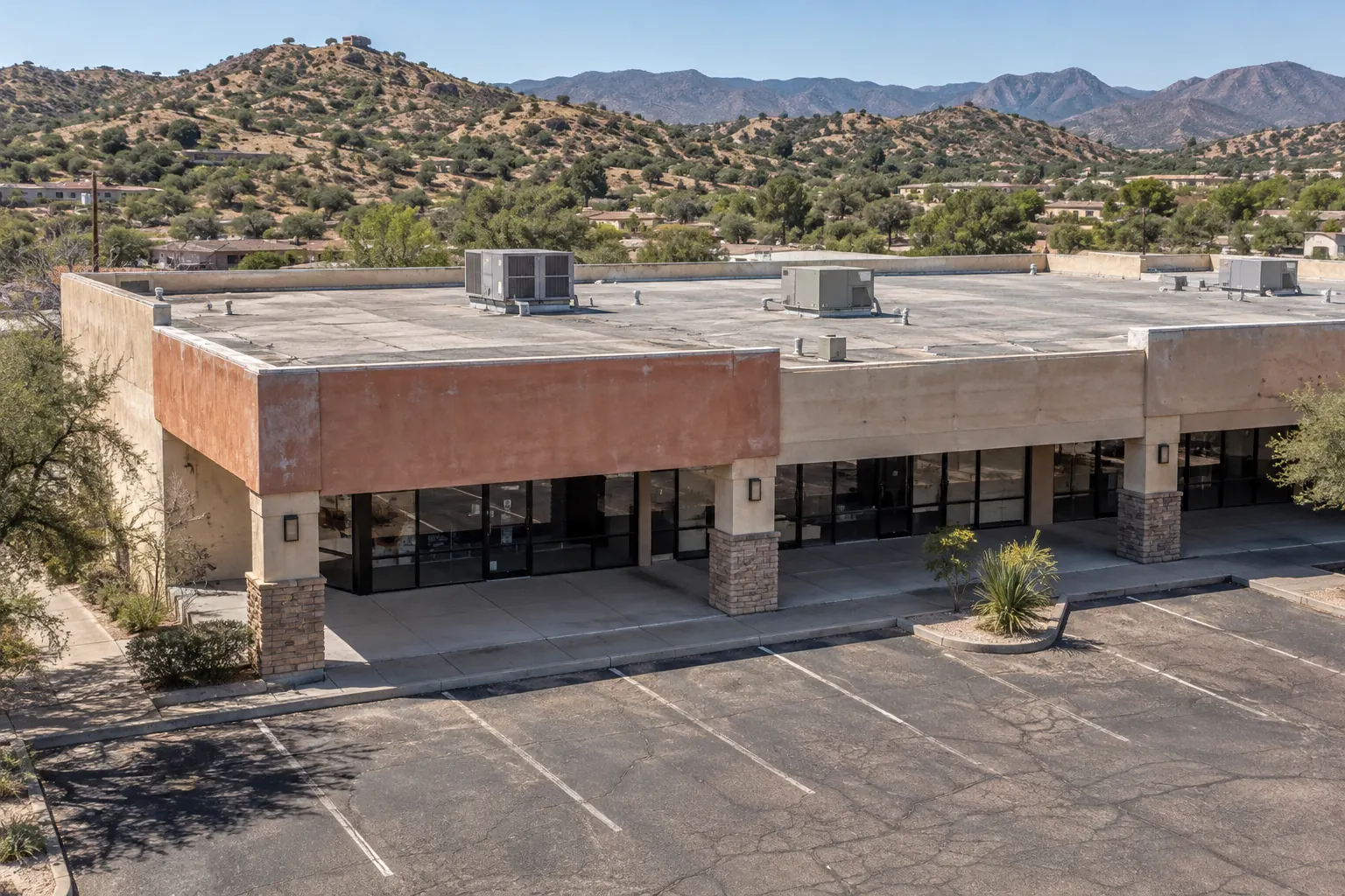 Single-story retail building with a low-slope roof and rooftop units